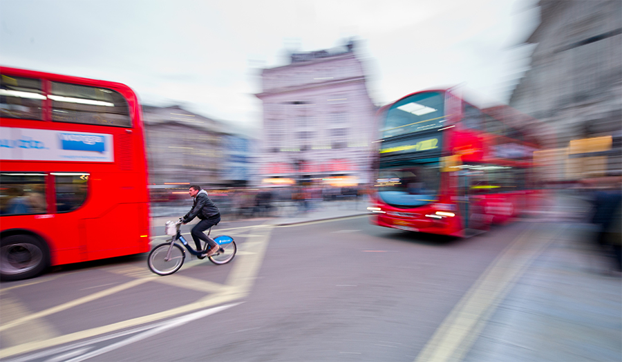London buses and a cyclist