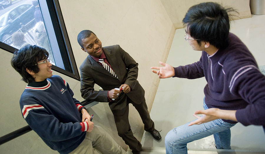 ELS students on Grad Centre staircase brown suit centre