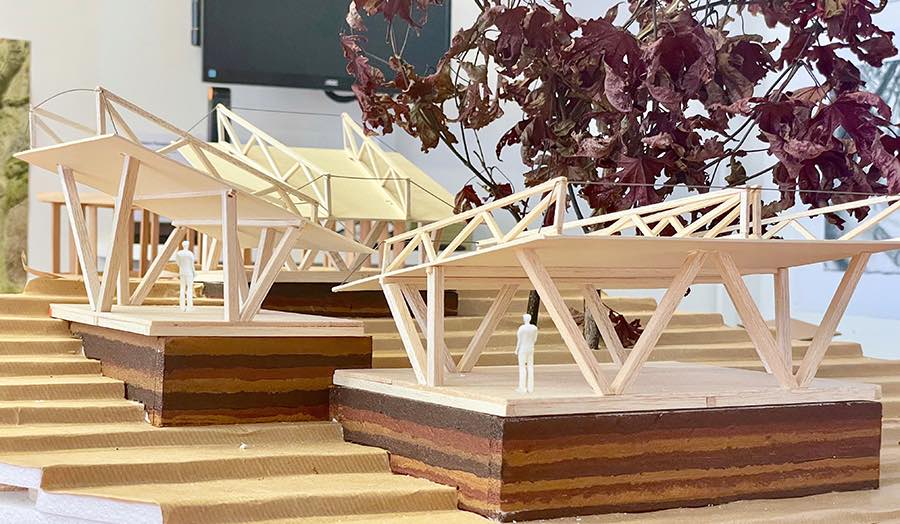 Detailed model of a structural canopies on a sloping terrain set against an autumnal tree