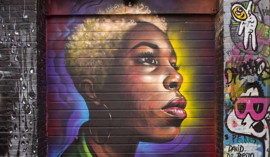 Graffiti style image of a woman on a wall