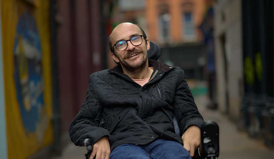 Josh pictured in Soho, smiling