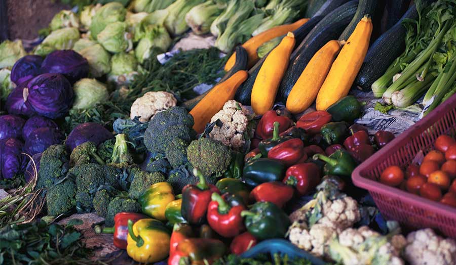 Different varieties of vegetables grouped together in a display