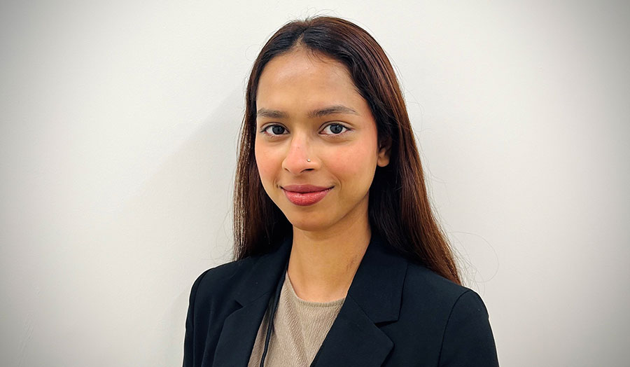 Shrabani Bhattacharjee smiling in a suit